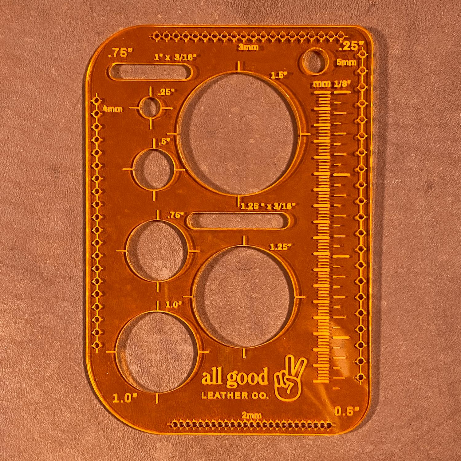 Leatherworking multi-tool shown on vegetable-tanned leather with stitched guide holes and layout markings