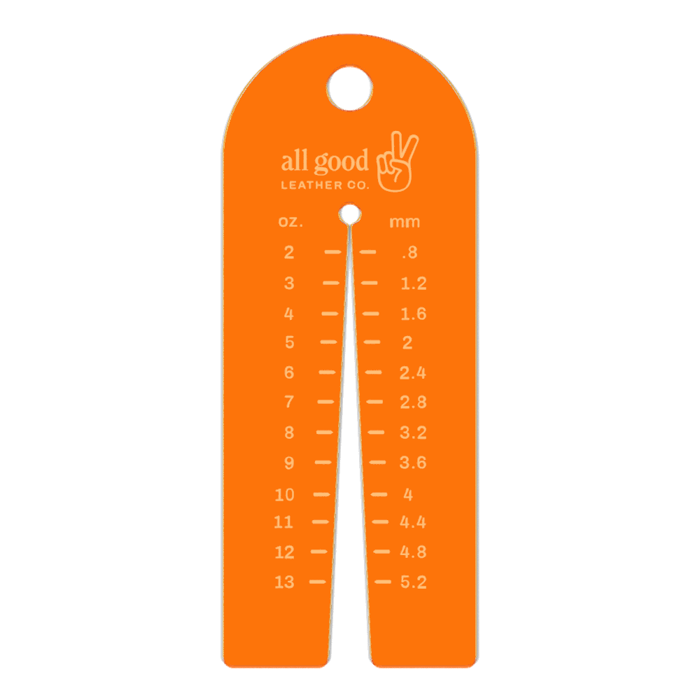 Leather thickness gauge tool made from fluorescent orange acrylic with metric and imperial markings