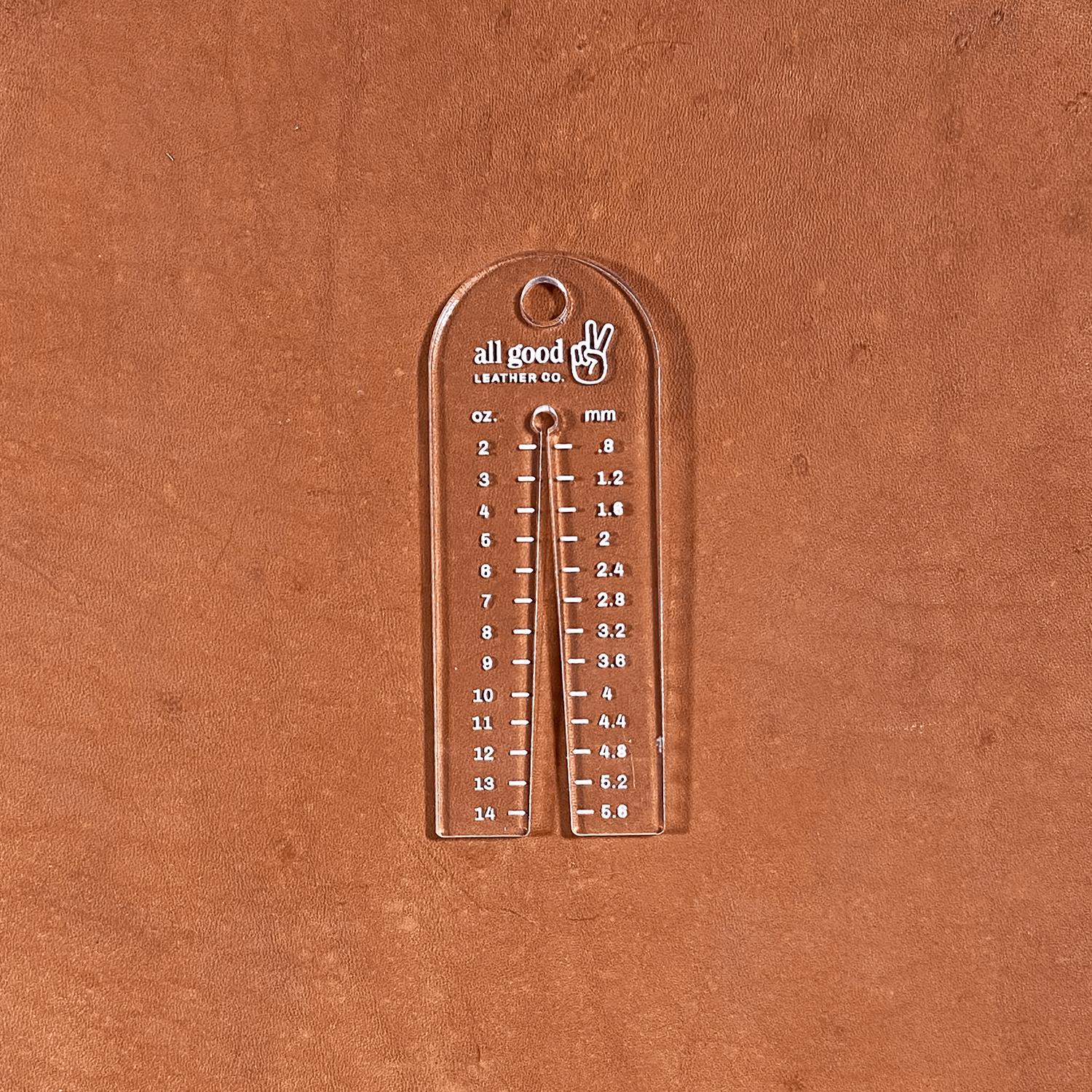 Leather thickness gauge tool shown on vegetable-tanned leather measuring hide thickness