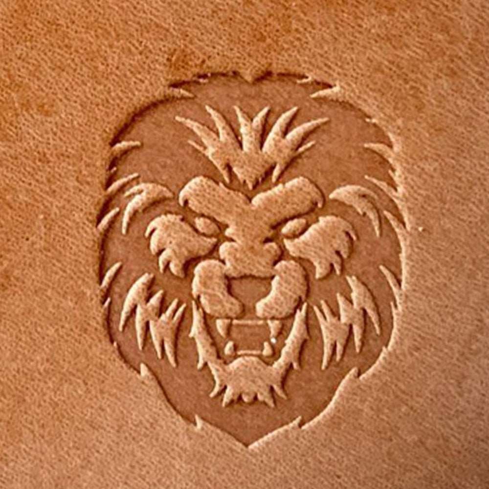 Lion head design stamped into natural veg-tan leather using a Delrin leather stamp, showing deep texture and defined fur details.