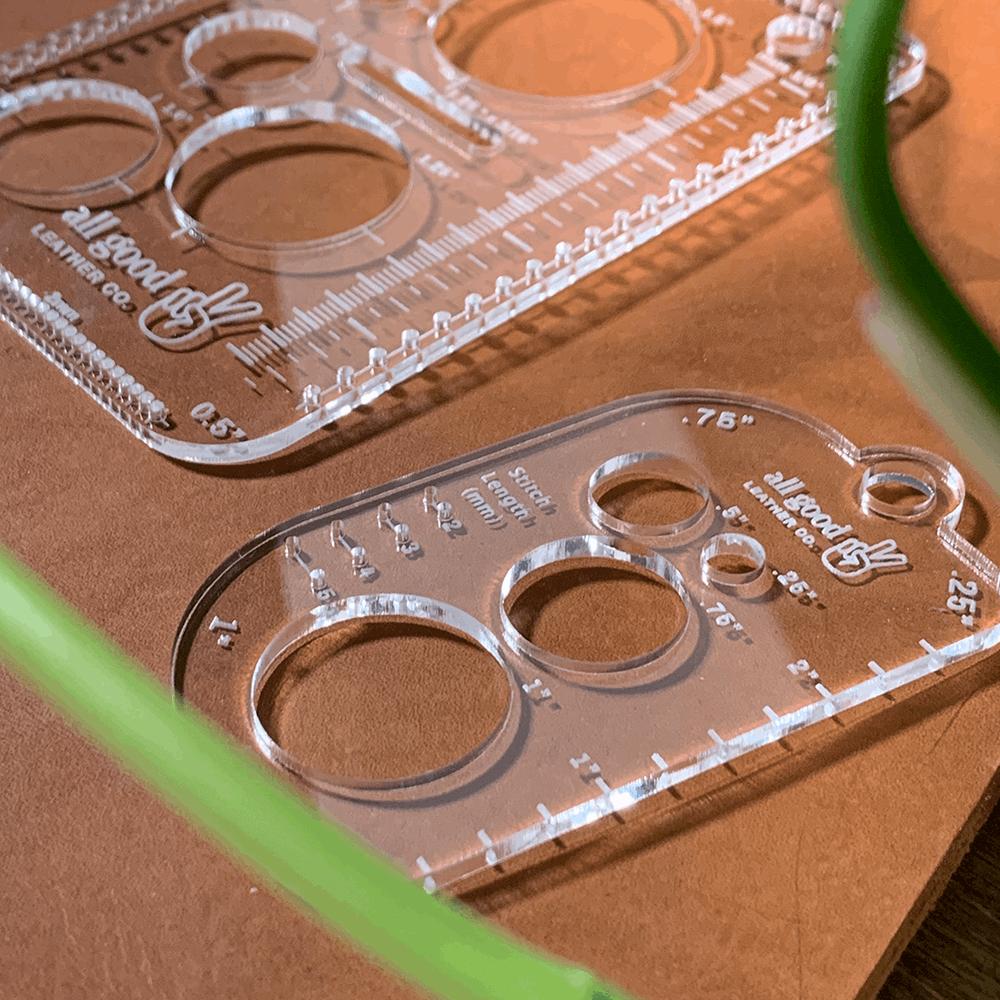 Clear acrylic leatherworking multi-tools in use on vegetable-tanned leather for measuring and layout