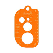 Pocket size leatherworking multi-tool made from fluorescent orange acrylic with rulers, circle stencils, and layout guides