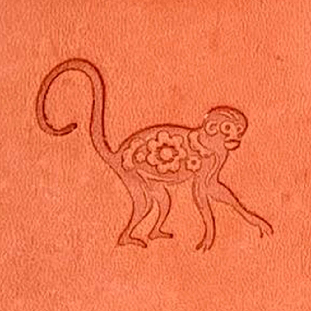 A straightforward line drawing of the Chinese Zodiac Monkey with a curvy tail on an orange background, featuring its back adorned with intricate floral patterns.